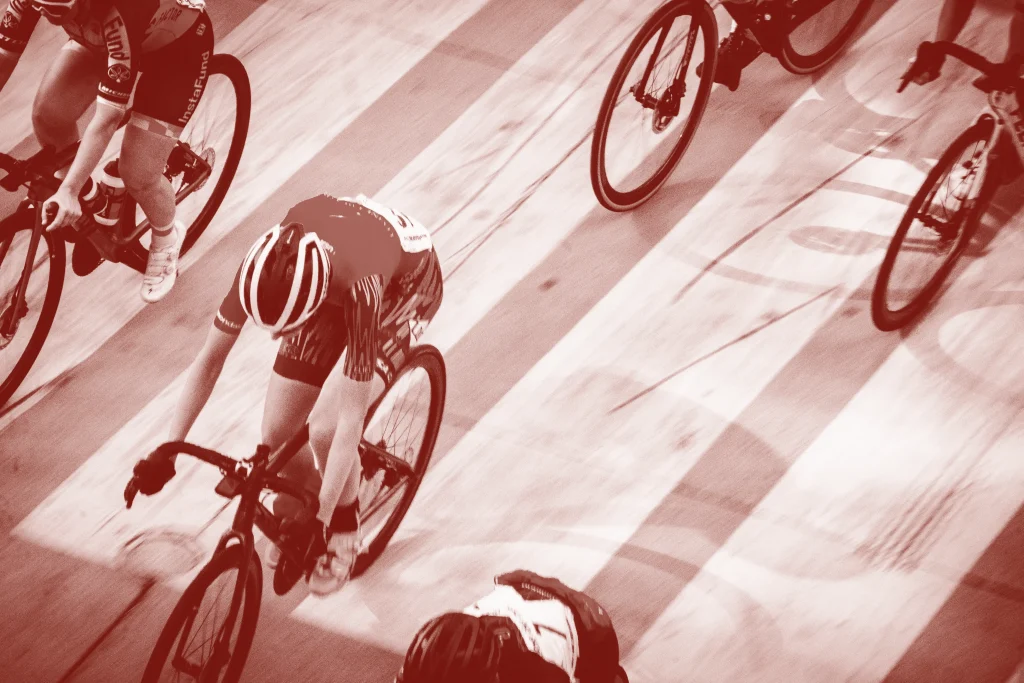 Cyclists on velodrome track
